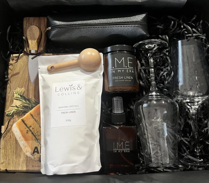 Fresh Linen gift box with candle, washing crystals, glassware, and serving accessories