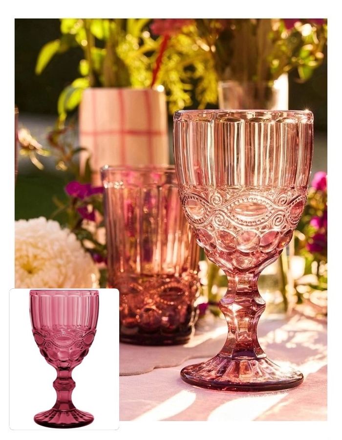 Ornate pink goblets styled on a sunlit table