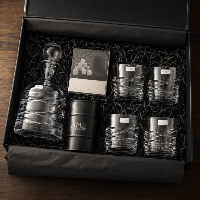 Whisky gift box with a crystal decanter, four cut-glass tumblers, whisky stones, and an I.M.E candle